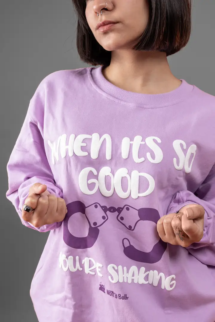 Close-up of the raised lilac puff-print sweatshirt