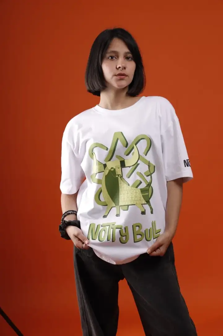 Model in the white graphic bull tee